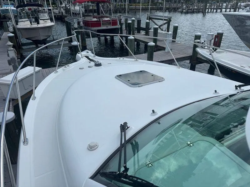 Slide: The Image of 2007 Tiara Yachts 3000 Open boat deck with windshield and hatch. - 20