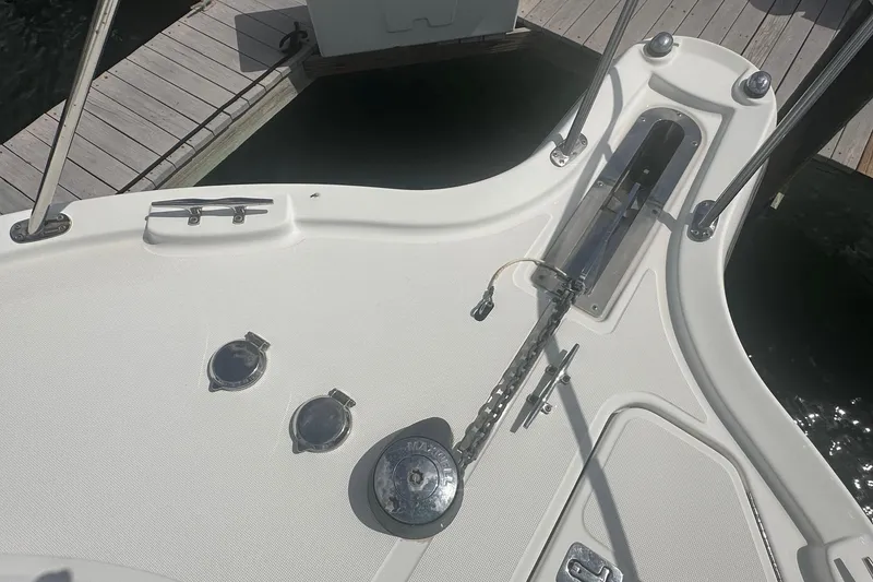 Slide: The Image of Bow deck of 2007 Tiara Yachts 3000 Open, featuring anchor and mooring cleats. - 21
