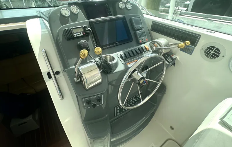 Slide: The Image of 2007 Tiara Yachts 3000 Open cabin kitchen with sink, stove, and microwave. - 28