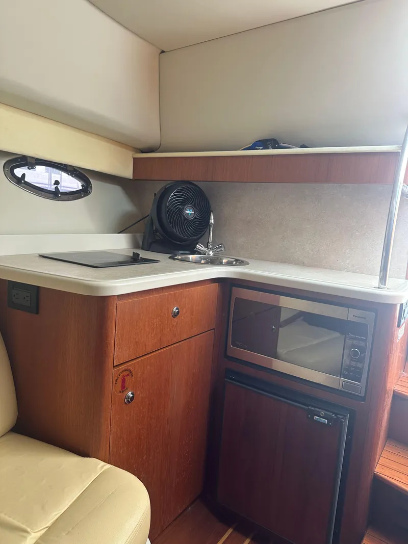 Slide: The Image of Onan generator in a 2007 Tiara Yachts 3000 Open engine compartment. - 35