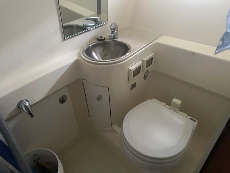 Slide: The Image of Engine compartment of a 2007 Tiara Yachts 3000 Open, showcasing detailed mechanical components. - 38