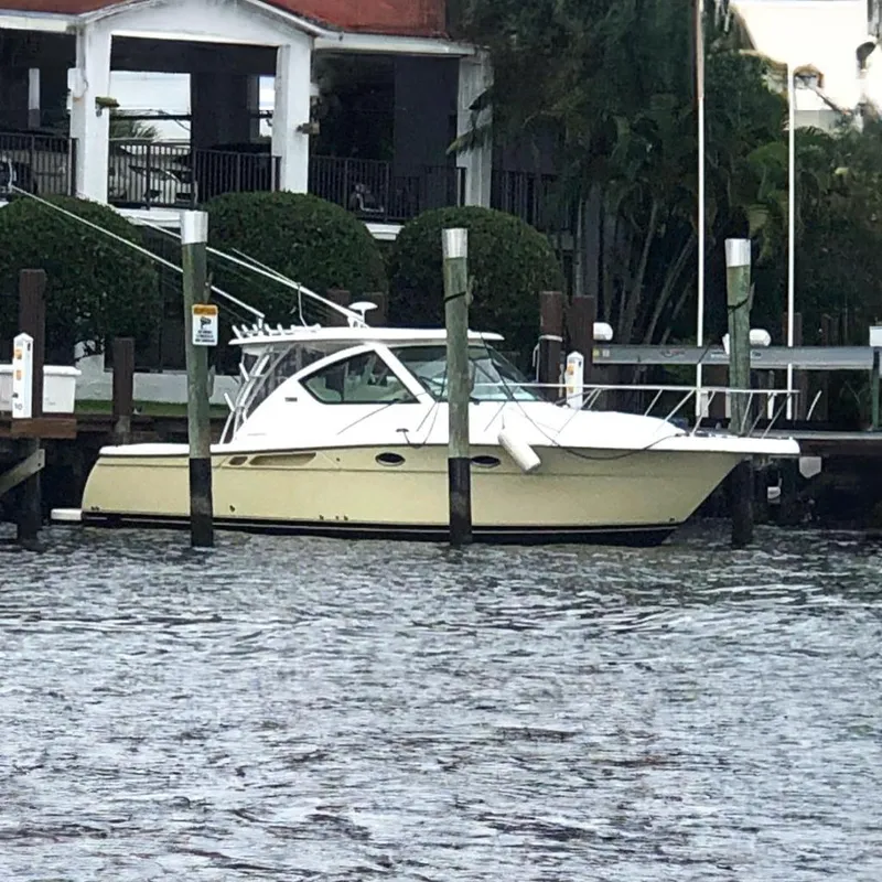 Slide: The Image of 2007 Tiara Yachts 3000 Open docked, featuring sleek design and spacious deck. - 4
