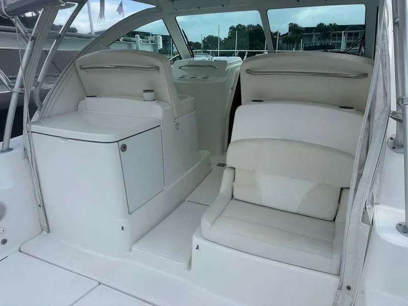 Slide: The Image of 2007 Tiara Yachts 3000 Open docked at marina, front view. - 5