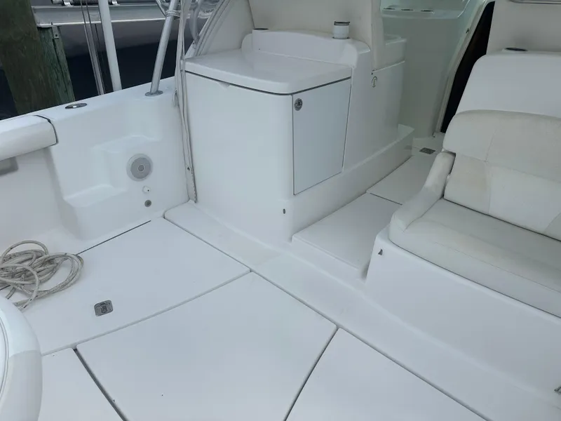 Slide: The Image of 2007 Tiara Yachts 3000 Open docked at marina under cloudy sky. - 6