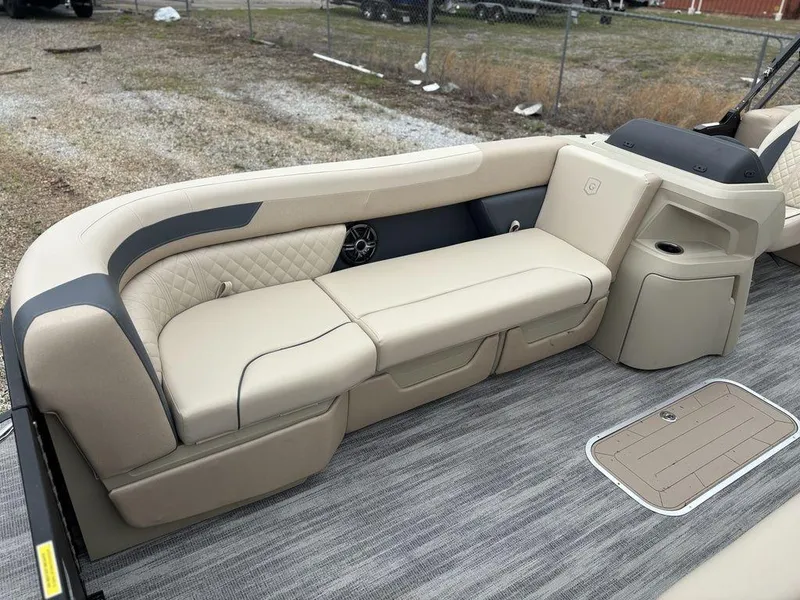 Slide: The Image of Luxurious seating on 2025 Godfrey SWEETWATER 2286 SB pontoon boat, featuring beige upholstery. - 10