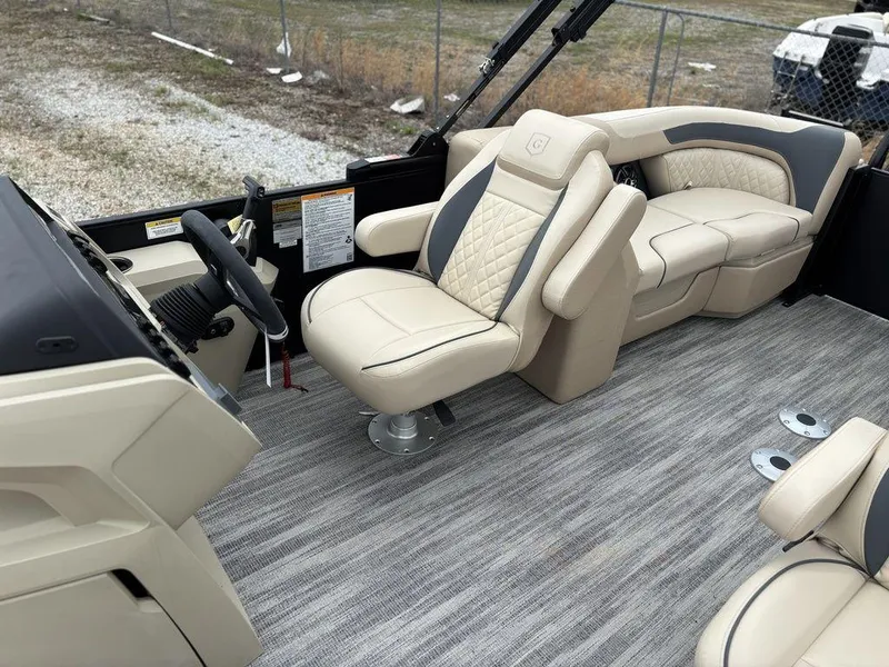 Slide: The Image of 2025 Godfrey SWEETWATER 2286 SB boat interior with luxurious seating and modern design. - 12