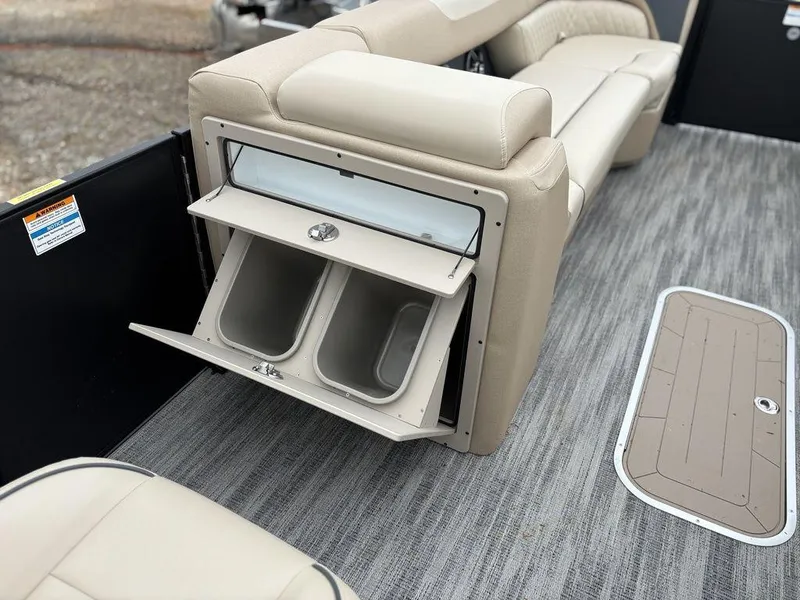 Slide: The Image of 2025 Godfrey SWEETWATER 2286 SB boat interior with storage compartments and seating. - 16