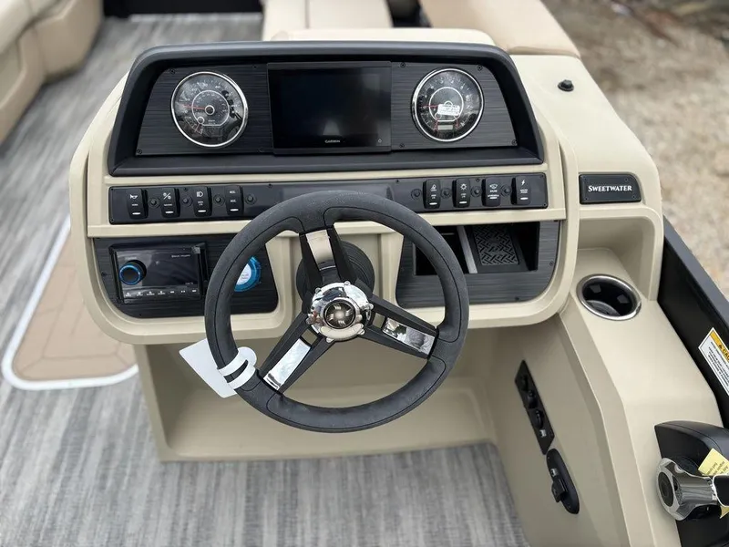 Slide: The Image of 2025 Godfrey SWEETWATER 2286 SB boat dashboard with steering wheel and control panel. - 18