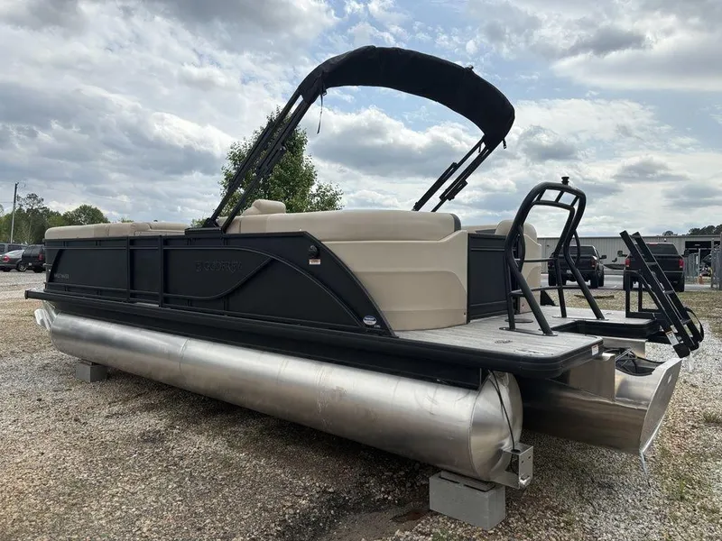 Slide: The Image of 2025 Godfrey SWEETWATER 2286 SB pontoon boat with canopy, parked on gravel. - 6