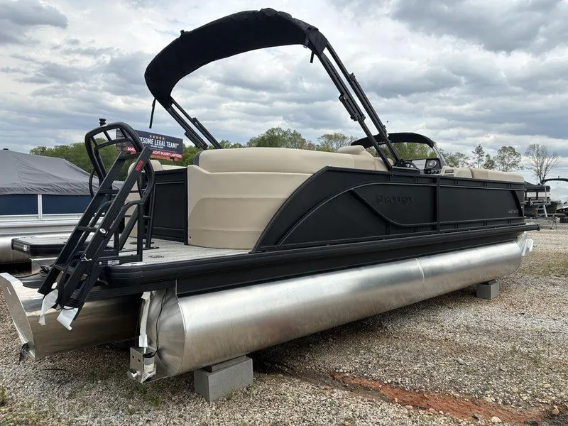 Slide: The Image of 2025 Godfrey SWEETWATER 2286 SB pontoon boat with canopy, parked on gravel. - 9