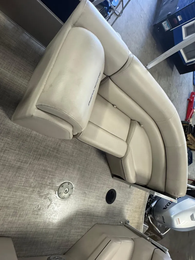 Slide: The Image of 2020 Berkshire 22RFX boat interior with beige seating and flooring. - 11