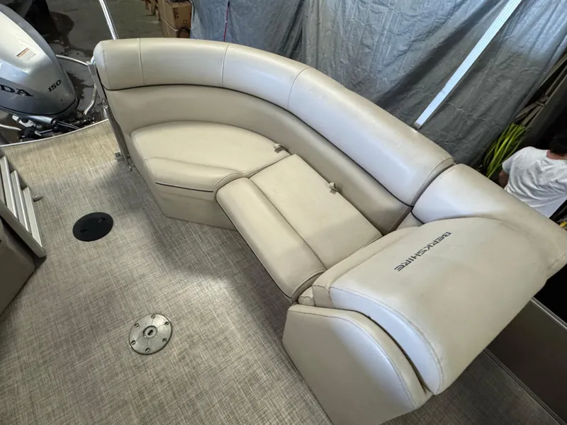 Slide: The Image of Luxurious seating on a 2020 Berkshire 22RFX pontoon boat with beige upholstery. - 16