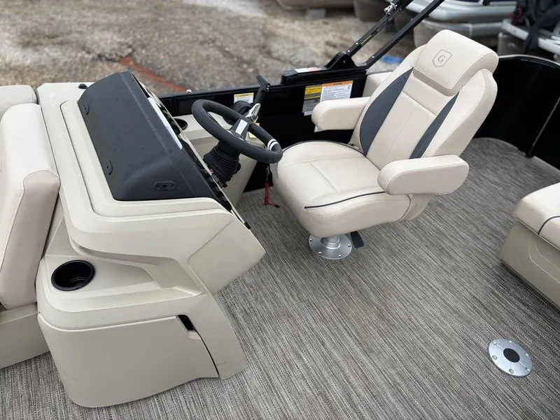 Slide: The Image of Captain's seat and helm of 2025 Godfrey Sweetwater 2086 C pontoon boat. - 11