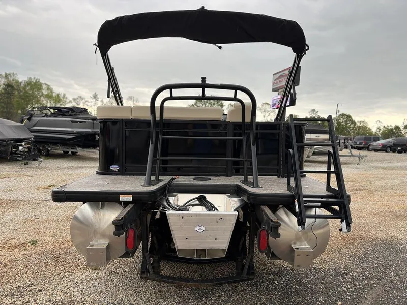 Slide: The Image of 2025 Godfrey Sweetwater 2086 C pontoon boat, rear view with ladder and canopy. - 3