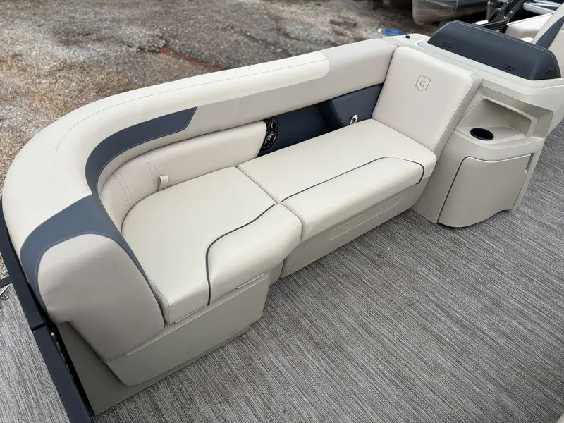Slide: The Image of 2025 Godfrey Sweetwater 2086 C boat interior with beige seating and modern design. - 8
