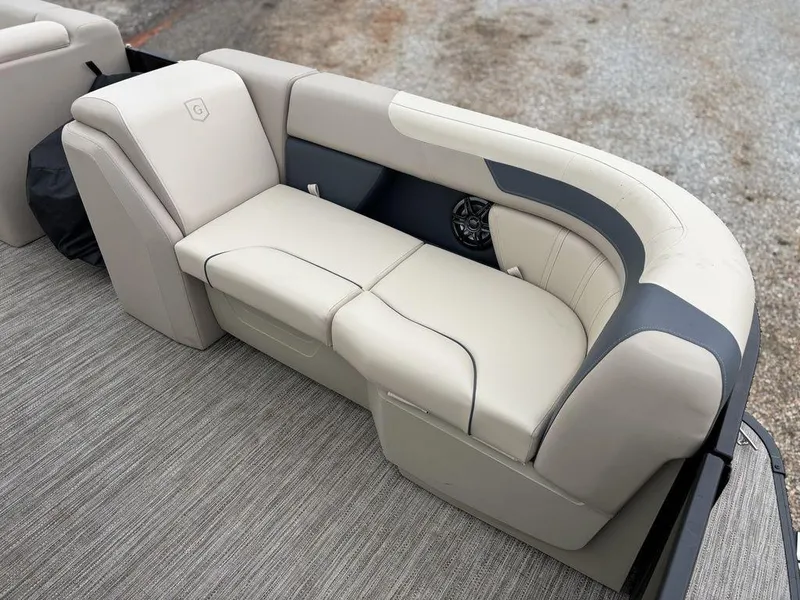 Slide: The Image of 2025 Godfrey Sweetwater 2086 C boat seating with beige upholstery and modern design. - 9