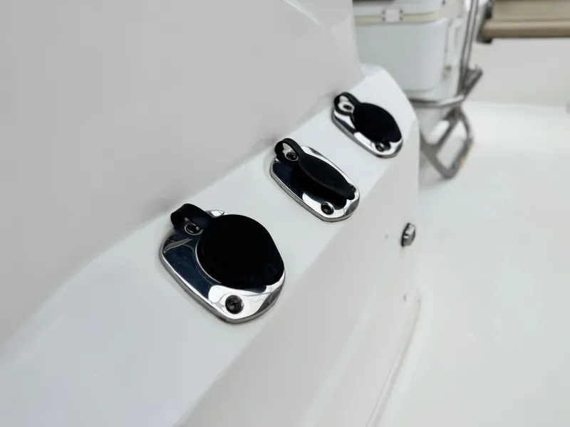 Slide: The Image of 2018 NauticStar 1910 boat deck with three stainless steel fittings. - 13