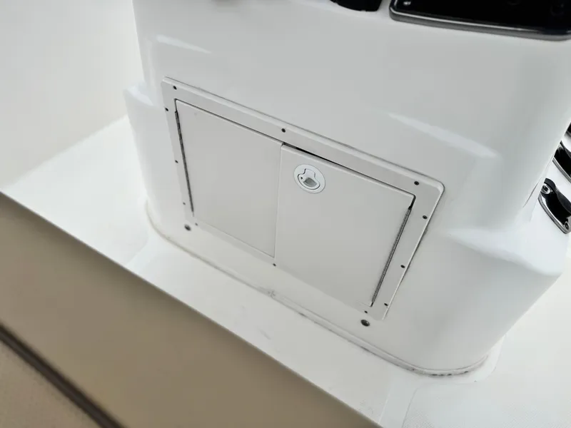Slide: The Image of 2018 NauticStar 1910 boat storage compartment with lockable door. - 20