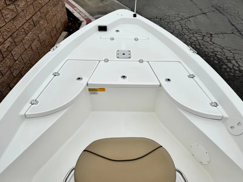 Slide: The Image of 2018 NauticStar 1910 boat deck with storage compartments and seating. - 7
