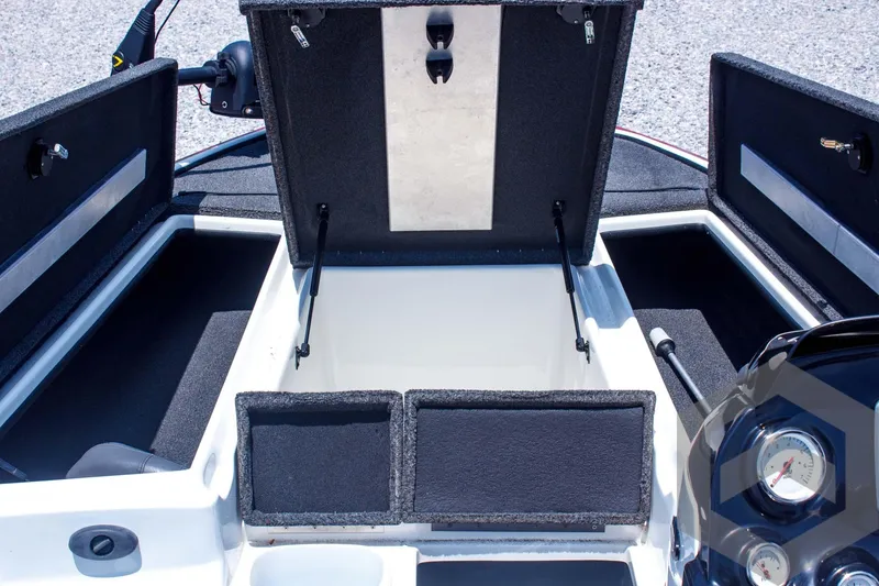 Slide: The Image of 2014 Nitro Z Series Z-7 boat storage compartments with open lids and dashboard view. - 17