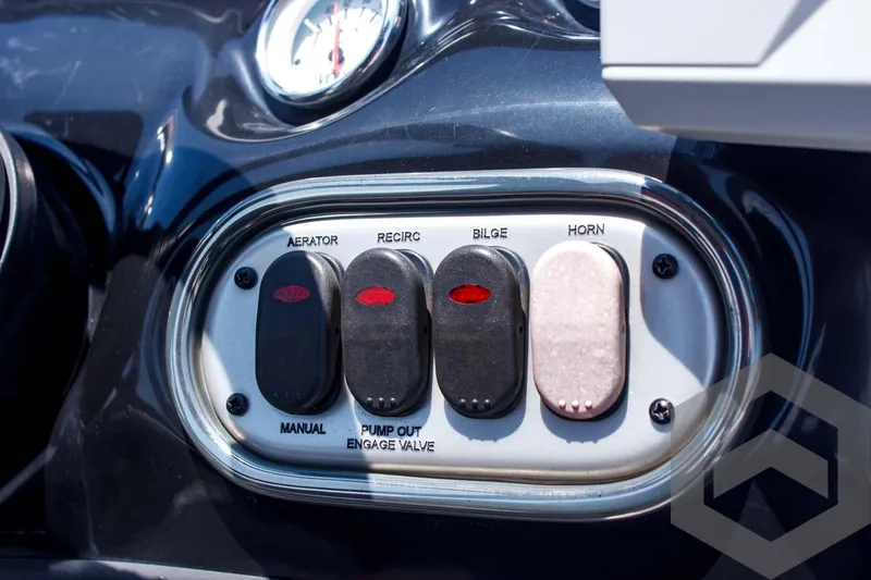 Slide: The Image of Control panel of a 2014 Nitro Z Series Z-7 boat with switches for aerator, recirc, bilge, and horn. - 31
