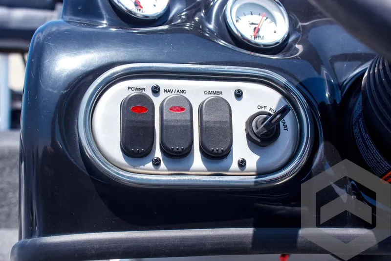 Slide: The Image of Control panel of 2014 Nitro Z Series Z-7 boat with switches and gauges. - 32