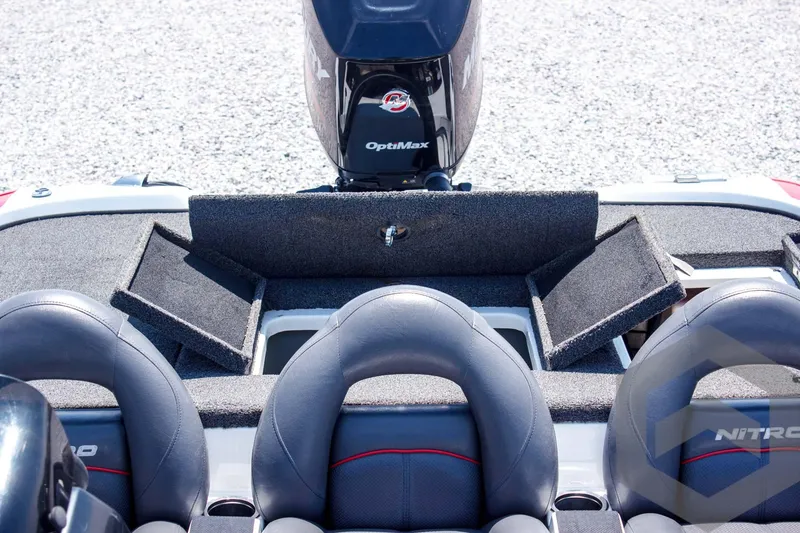 Slide: The Image of 2014 Nitro Z Series Z-7 boat interior with storage compartments and OptiMax engine. - 35