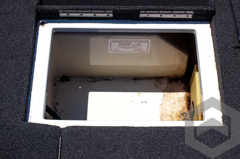 Slide: The Image of 2014 Nitro Z Series Z-7 storage compartment, open and empty, with visible wear. - 37