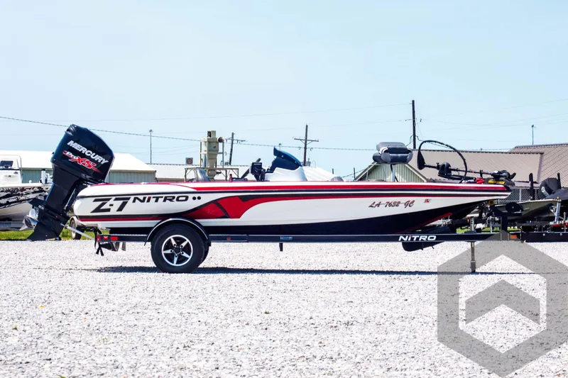Slide: The Image of 2014 Nitro Z Series Z-7 boat with Mercury engine on a gravel lot. - 4