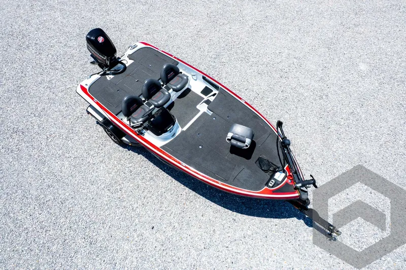 Slide: The Image of 2014 Nitro Z Series Z-7 boat, aerial view, red and black design, on gravel surface. - 40