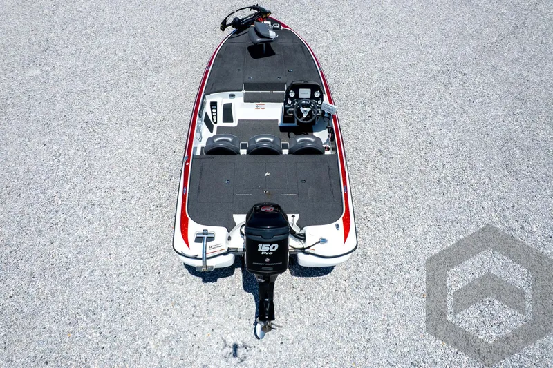 Slide: The Image of 2014 Nitro Z Series Z-7 boat, aerial view, featuring a 150 HP engine on a gravel surface. - 43