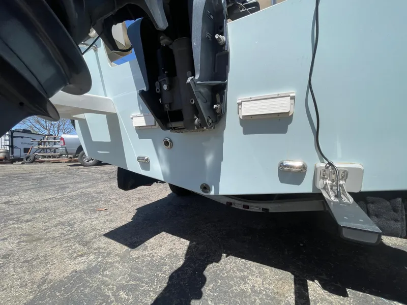 Slide: The Image of 2017 Parker 1801 CC boat stern view with motor and hardware details. - 18