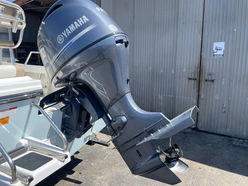 Slide: The Image of Outboard motor on a 2017 Parker 1801 CC boat, featuring a Yamaha engine. - 19