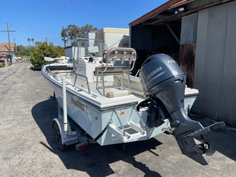 Slide: The Image of 2017 Parker 1801 CC boat with Yamaha outboard motor on a trailer. - 2