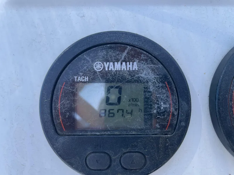 Slide: The Image of Yamaha tachometer displaying 867.4 hours on a 2017 Parker 1801 CC boat. - 22