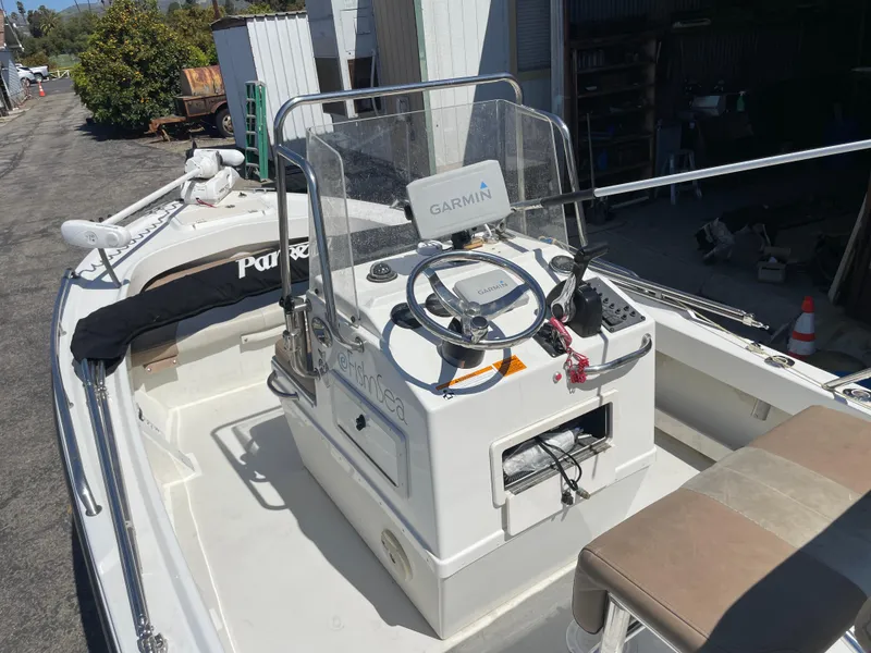 Slide: The Image of 2017 Parker 1801 CC boat with Garmin navigation system, docked outdoors. - 4