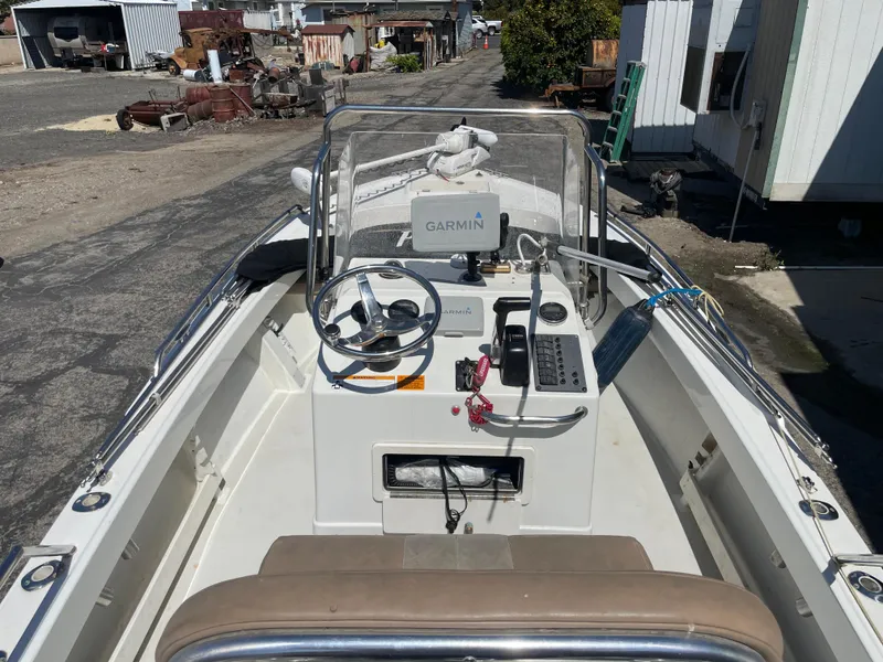Slide: The Image of 2017 Parker 1801 CC boat with Garmin navigation, docked in an industrial area. - 5