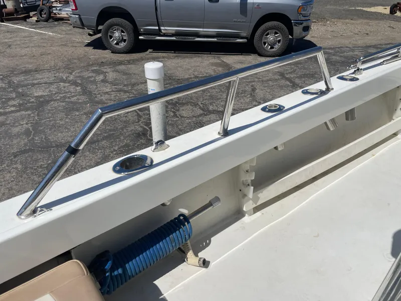 Slide: The Image of 2017 Parker 1801 CC boat interior with stainless steel railings and rod holders. - 7