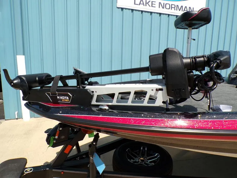 Slide: The Image of 2025 Skeeter ZXR19 boat with Minn Kota trolling motor, parked at Lake Norman. - 18