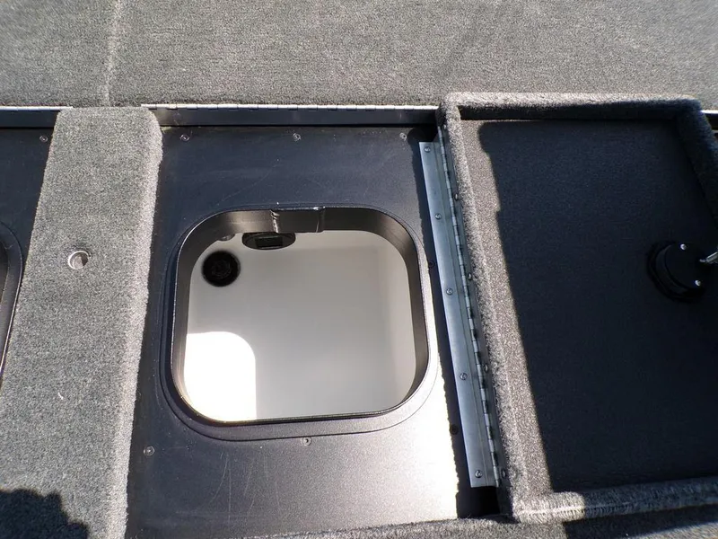 Slide: The Image of Open storage compartment on 2025 Skeeter ZXR19 boat deck. - 3