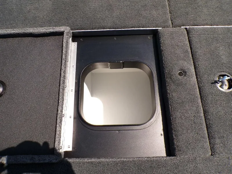 Slide: The Image of Open storage compartment on 2025 Skeeter ZXR19 boat deck. - 5