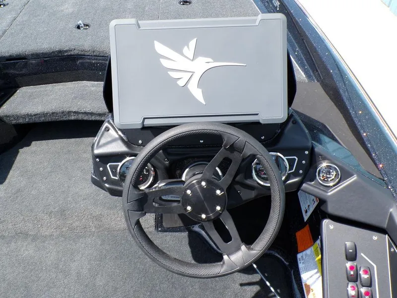 Slide: The Image of 2025 Skeeter ZXR19 boat dashboard with steering wheel and control panel. - 9