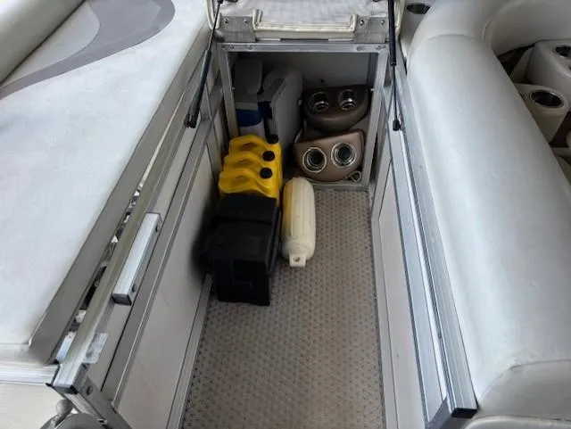 Slide: The Image of Storage compartment in 2007 Avalon Windjammer RC boat, featuring various equipment and accessories. - 12