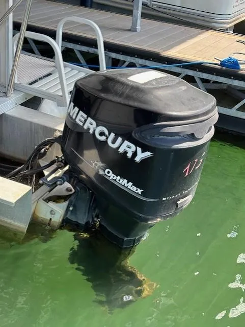 Slide: The Image of Mercury OptiMax outboard motor on 2007 Avalon Windjammer RC - 22' boat at dock. - 14