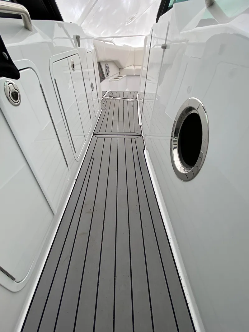 Slide: The Image of 2020 Cruisers Yachts 338OB boat deck with sleek design and modern features. - 8