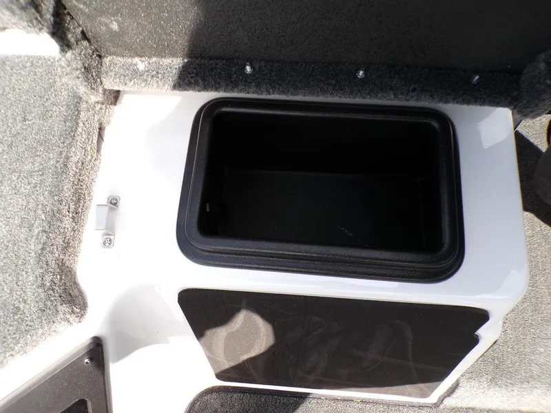 Slide: The Image of Storage compartment in 2025 Skeeter ZXR19 boat, featuring a sleek black interior. - 10