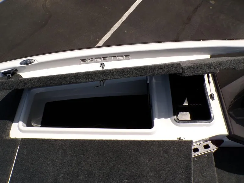 Slide: The Image of Open storage compartment on a 2025 Skeeter ZXR19 boat. - 11