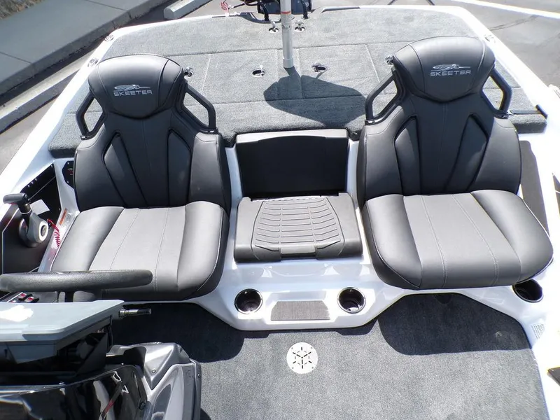 Slide: The Image of 2025 Skeeter ZXR19 boat interior with dual black seats and center console. - 8