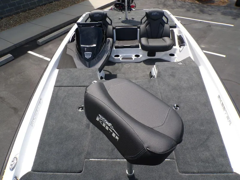Slide: The Image of 2025 Skeeter ZXR19 boat interior with seating and carpeted deck. - 9