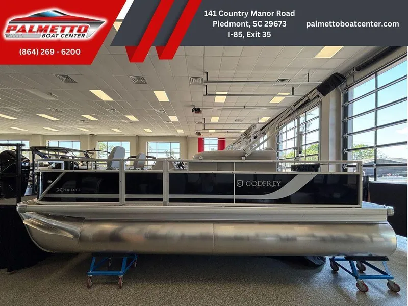 Slide: The Image of 2025 Godfrey Xperience 1886 FX pontoon boat displayed at Palmetto Boat Center showroom. - 1